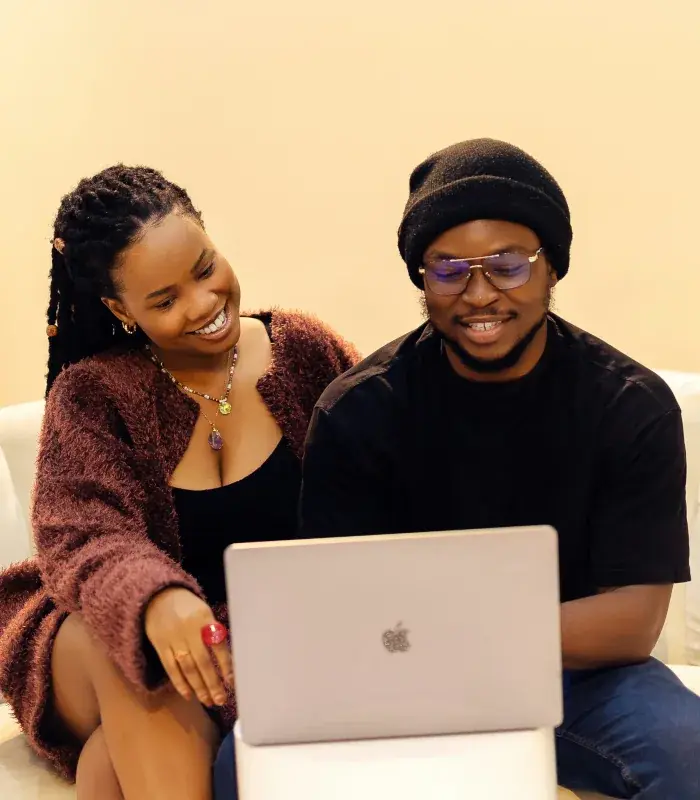 Woman and man playing lottery online together using a laptop.